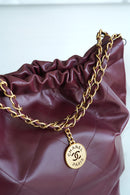 Bolsa CHANEL 22
