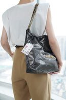 Bolsa CHANEL 22